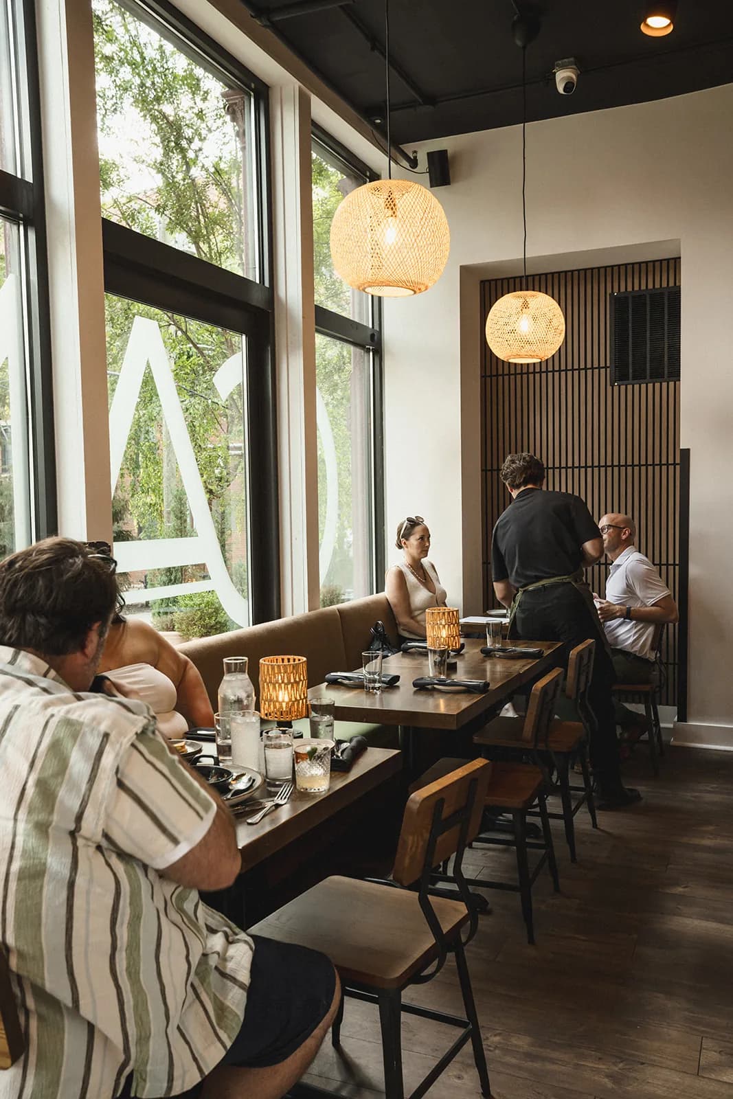 Guests at a window table in the Crown Cantina dining room